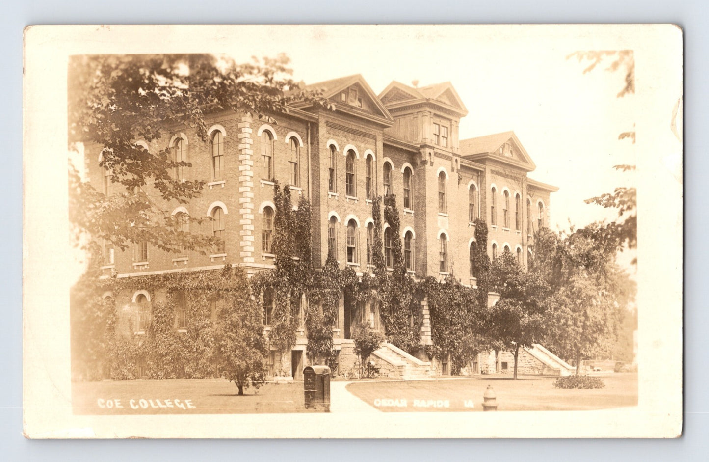 Cedar Rapids Iowa Coe College campus building 1910s real photo postcard showing multi-story brick academic structure with ivy-covered façade