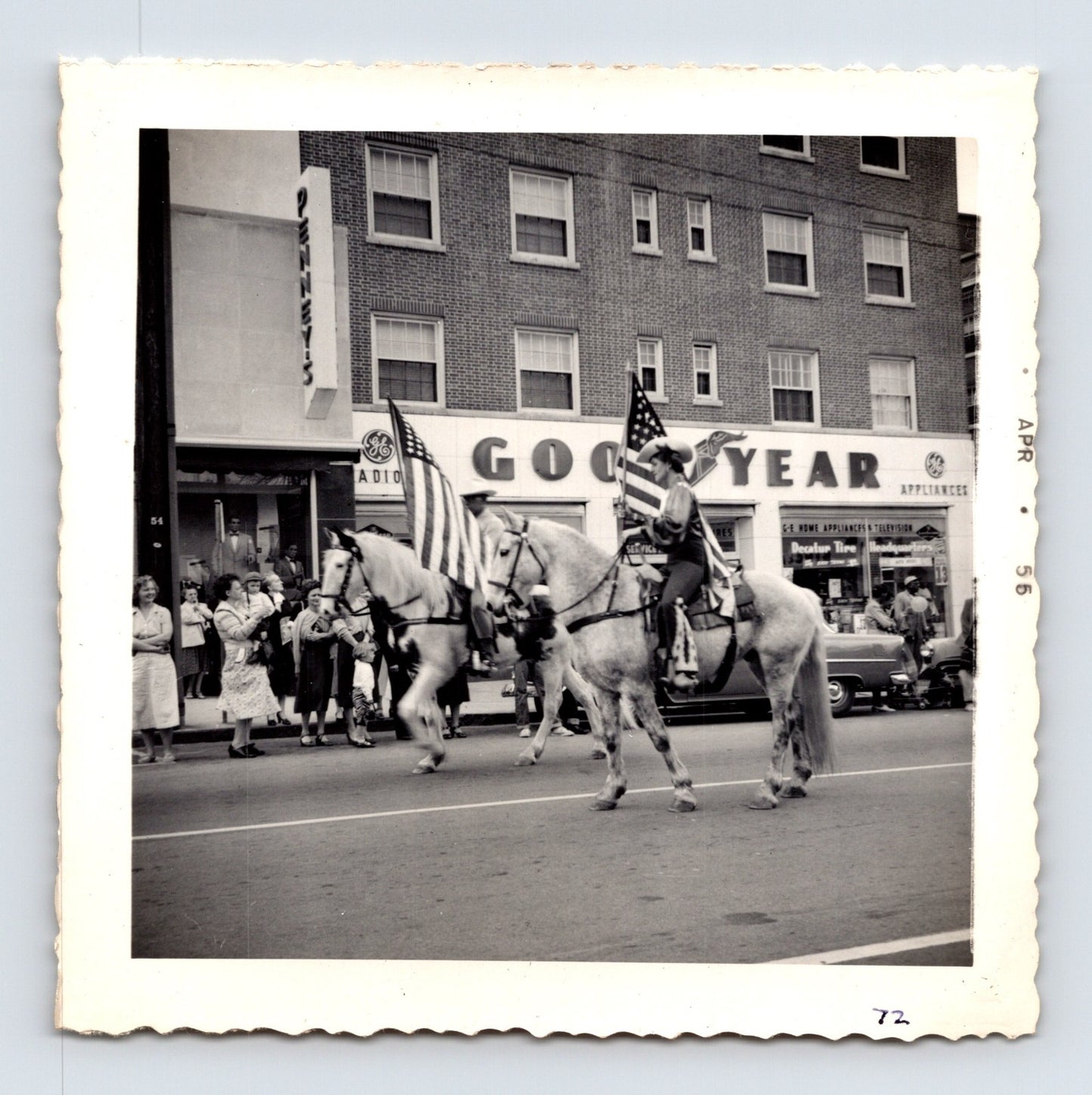 King Bros Circus 1955 horseback rider parade snapshot photograph showing flag-bearing performers riding through downtown Decatur GA