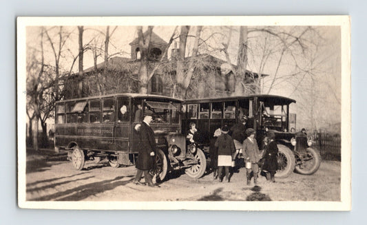 Kansas Erie Consolidated School 1930s photo showing early school bus with children and teachers gathered outside rural building