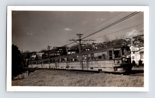 Key System F Line electric train traveling through residential hillside area in Berkeley, California, 1946 photograph.