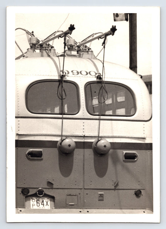 Philadelphia trolley bus rear view with overhead poles and electric connections 1950s transportation photo