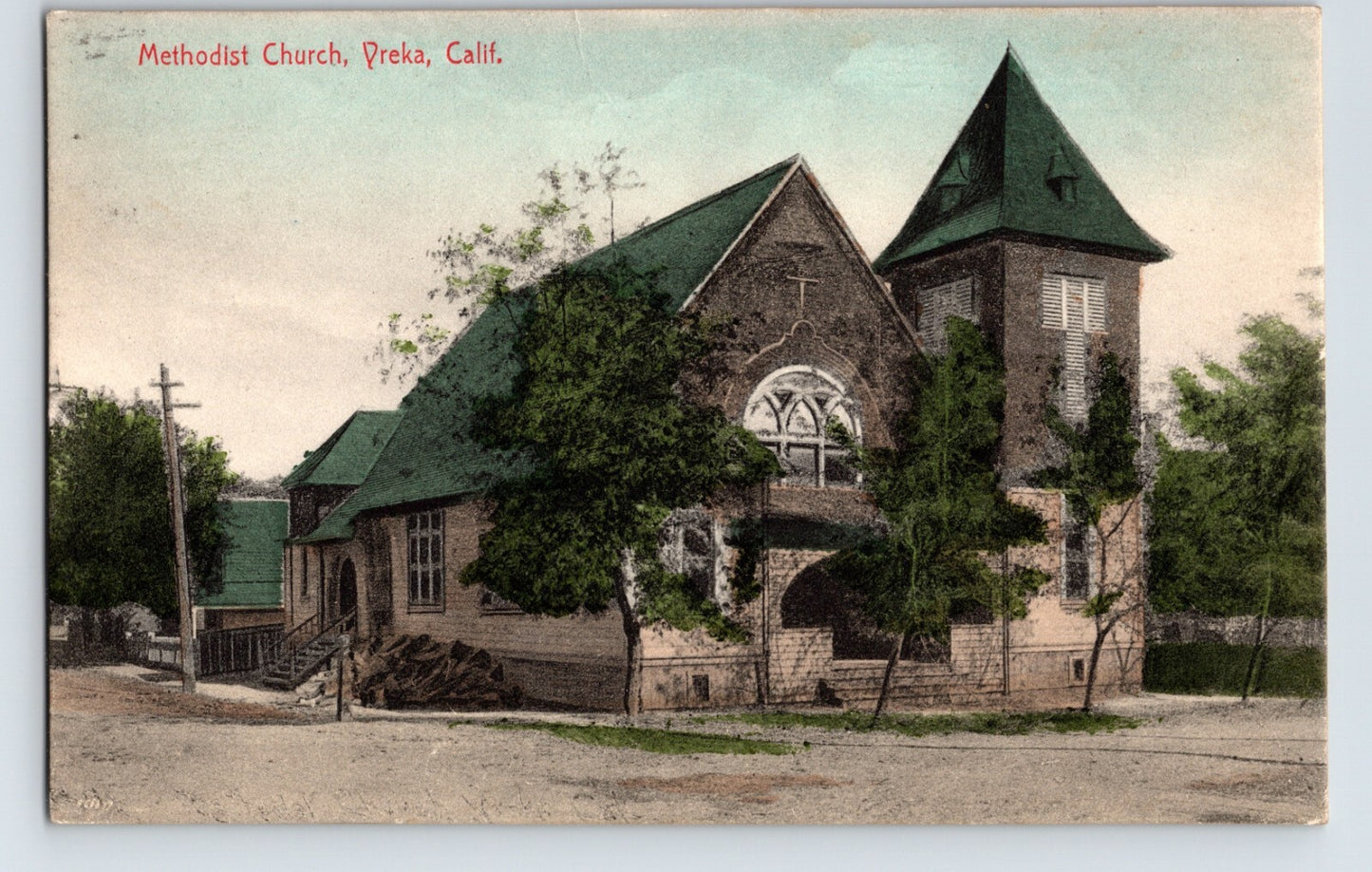 1910s Methodist Church Yreka California stone church building with green roof and tower posted divided back postcard