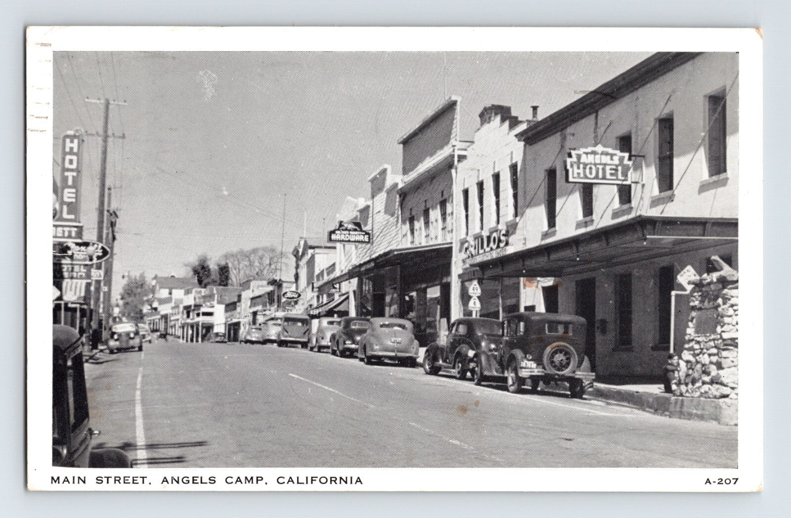 Angels Camp California Main Street downtown storefronts cars 1950s postcard
