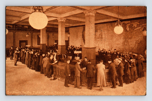 San Francisco California Palace Hotel Southern Pacific Railroad ticket office interior with long counters and large globe lights, circa 1920