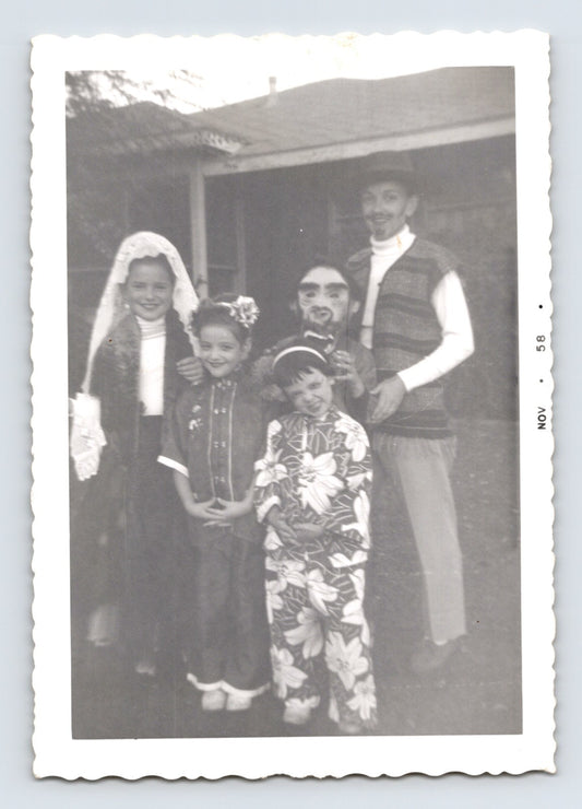 Halloween photo children costumes group porch 1950s snapshot kids dressed up masks makeup outdoor scene 5 x 3.5