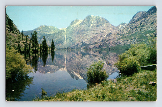 1964 Mono County California Silver Lake Devils Slide Carson Peak postcard showing mountain reflection in alpine lake with trees and shoreline