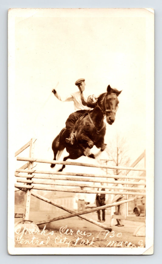 Sparks Circus horse and rider jumping hurdle Central City Park Macon Georgia 1930 sepia photograph