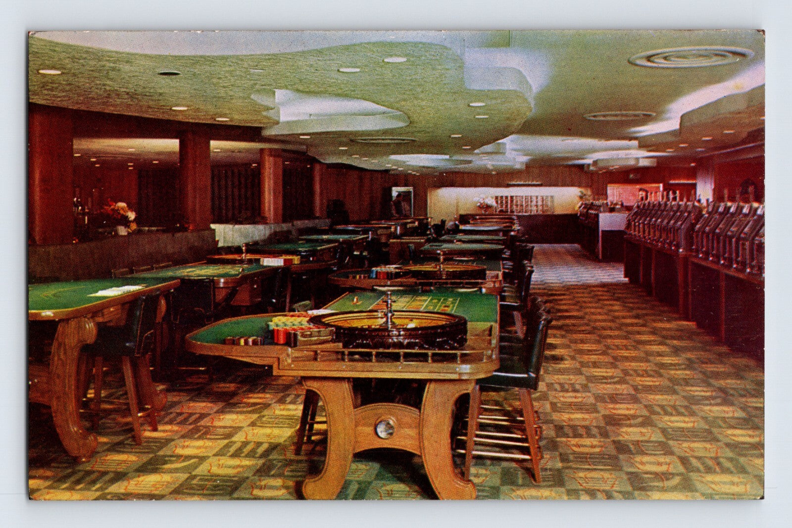 Las Vegas Nevada Hotel Sahara casino interior roulette tables slot machines 1950s chrome postcard