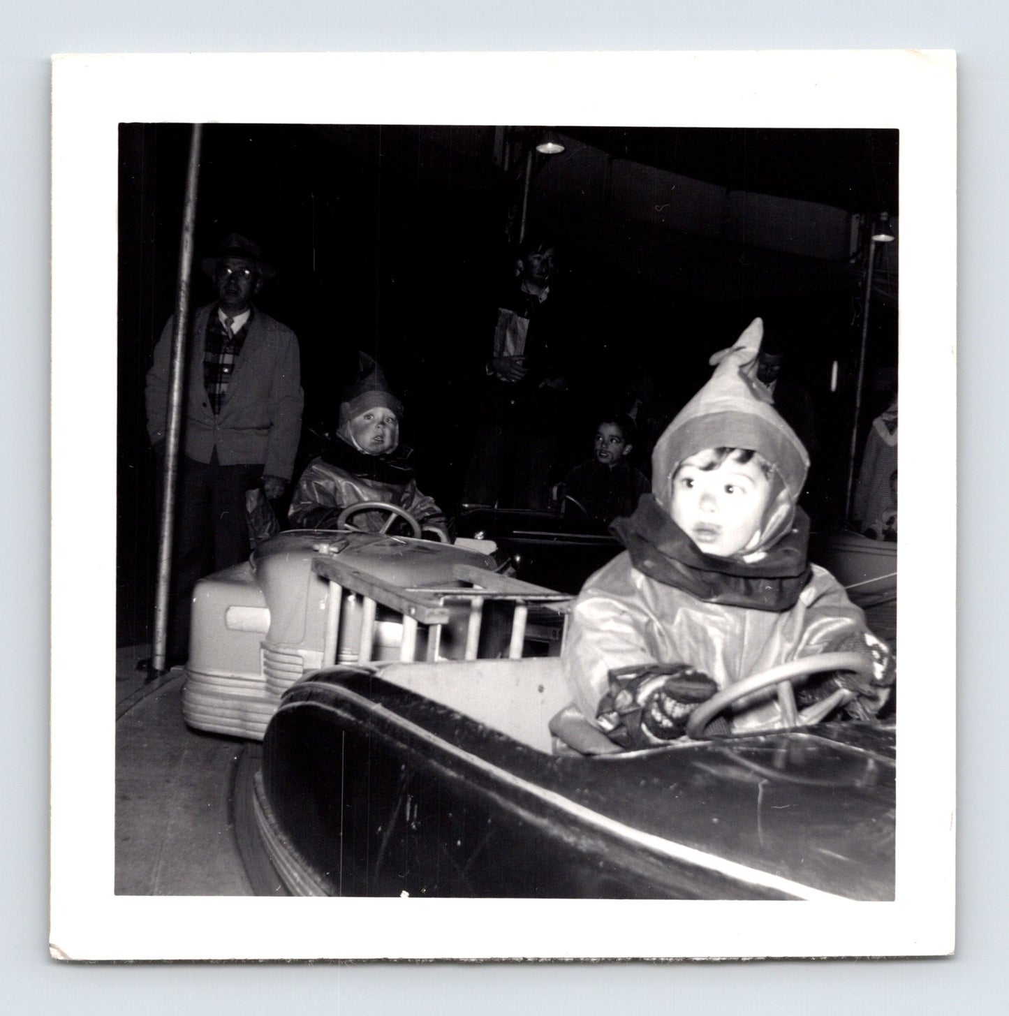 Halloween 1951 children costumes bumper cars amusement ride night snapshot vintage photo