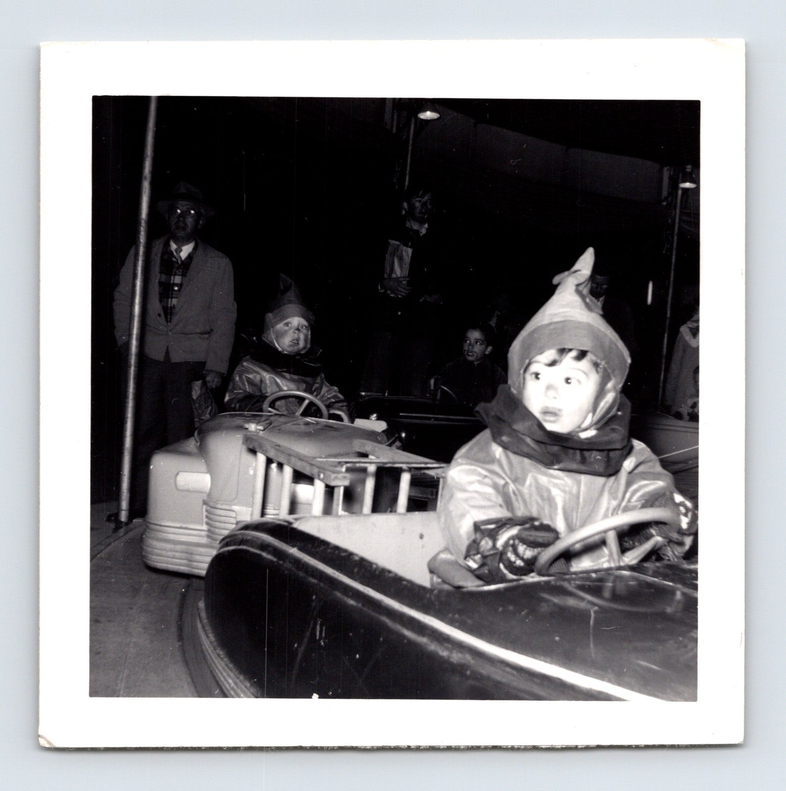 Halloween 1951 children costumes bumper cars amusement ride night snapshot vintage photo