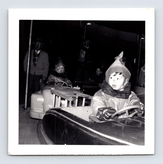 Halloween 1951 children costumes bumper cars amusement ride night snapshot vintage photo