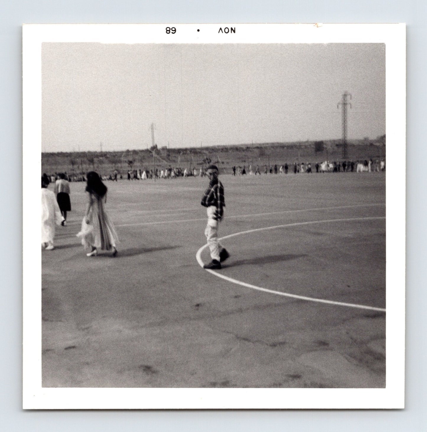 Halloween schoolyard parade children line distance playground mid century wide view 1960s snapshot 3.5 x 3.5 photo