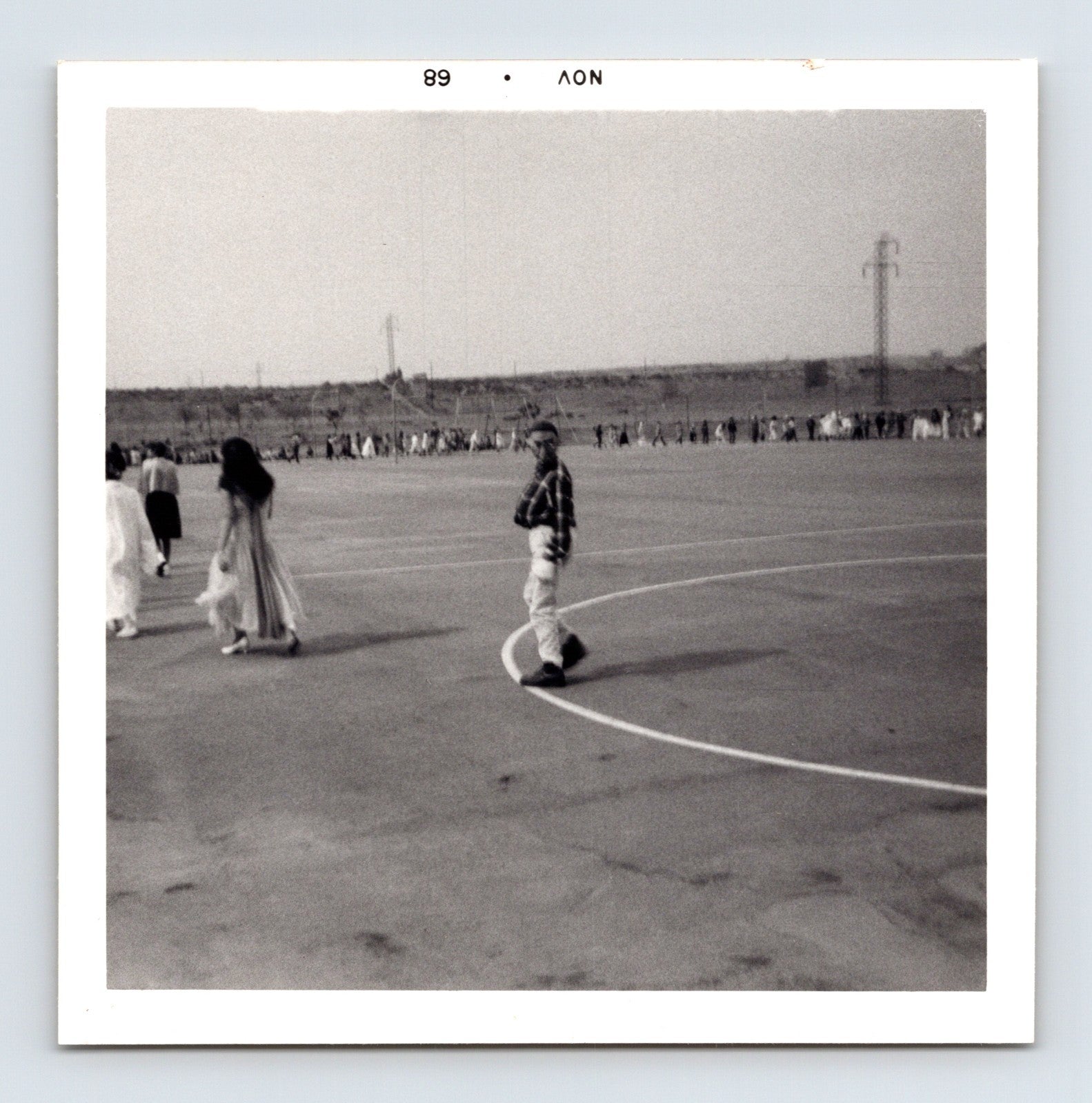 Halloween schoolyard parade children line distance playground mid century wide view 1960s snapshot 3.5 x 3.5 photo