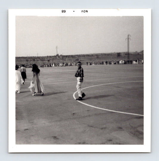 Halloween schoolyard parade children line distance playground mid century wide view 1960s snapshot 3.5 x 3.5 photo