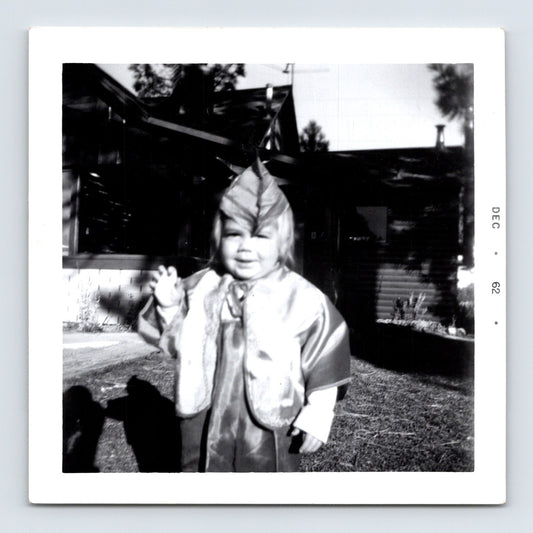 Vintage Halloween toddler costume snapshot 1962 outdoor yard black white photo child waving
