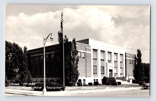 Audubon Iowa county courthouse RPPC 1940s brick civic building flagpole street view