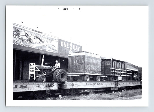 Clyde Beatty Circus 1961 photo railroad flatcar tractor loading circus equipment train