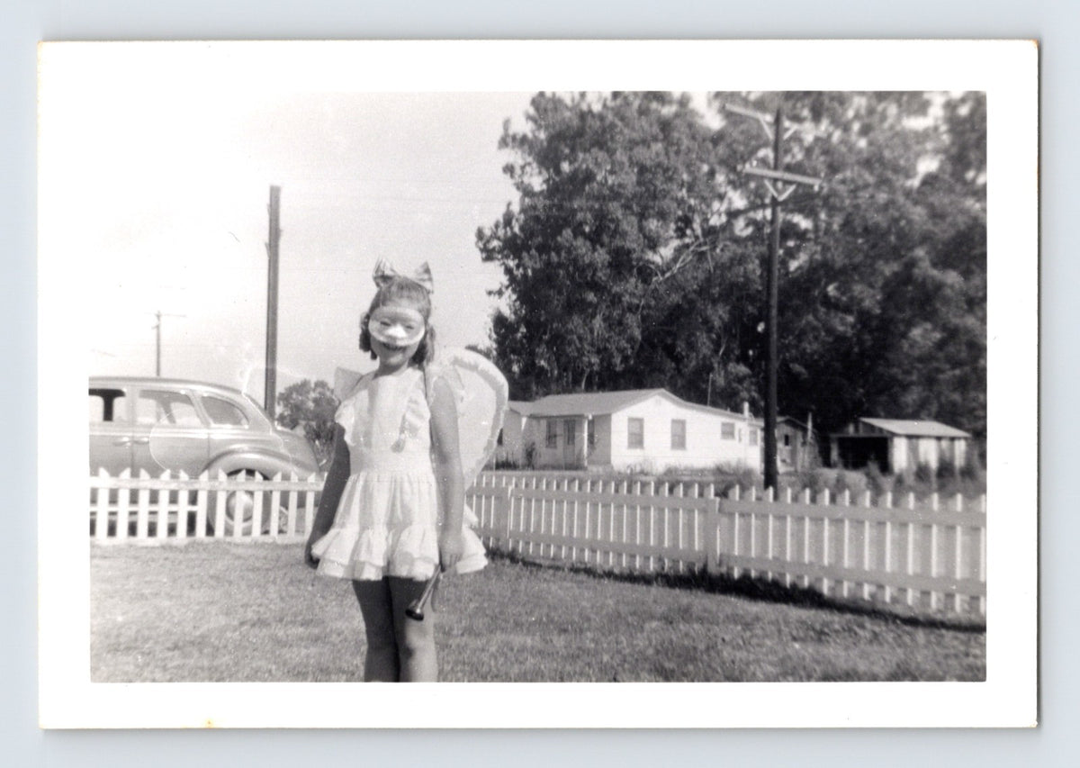 Girl Halloween fairy costume mask wings yard picket fence vintage snapshot