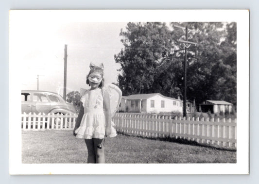 Girl Halloween fairy costume mask wings yard picket fence vintage snapshot
