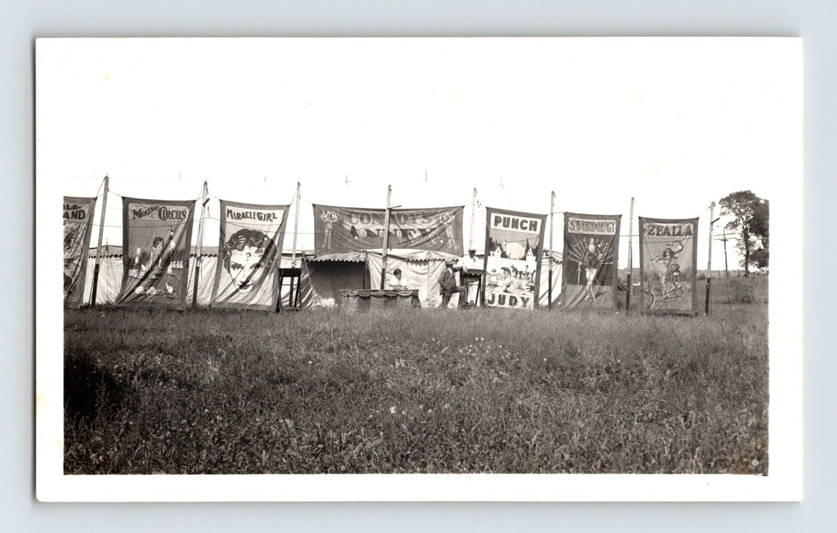 Vintage photo showing Conroy Bros Circus side show banner line with illustrated panels 1940s midway scene