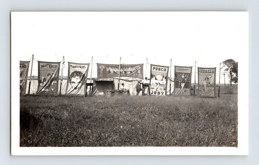Vintage photo showing Conroy Bros Circus side show banner line with illustrated panels 1940s midway scene