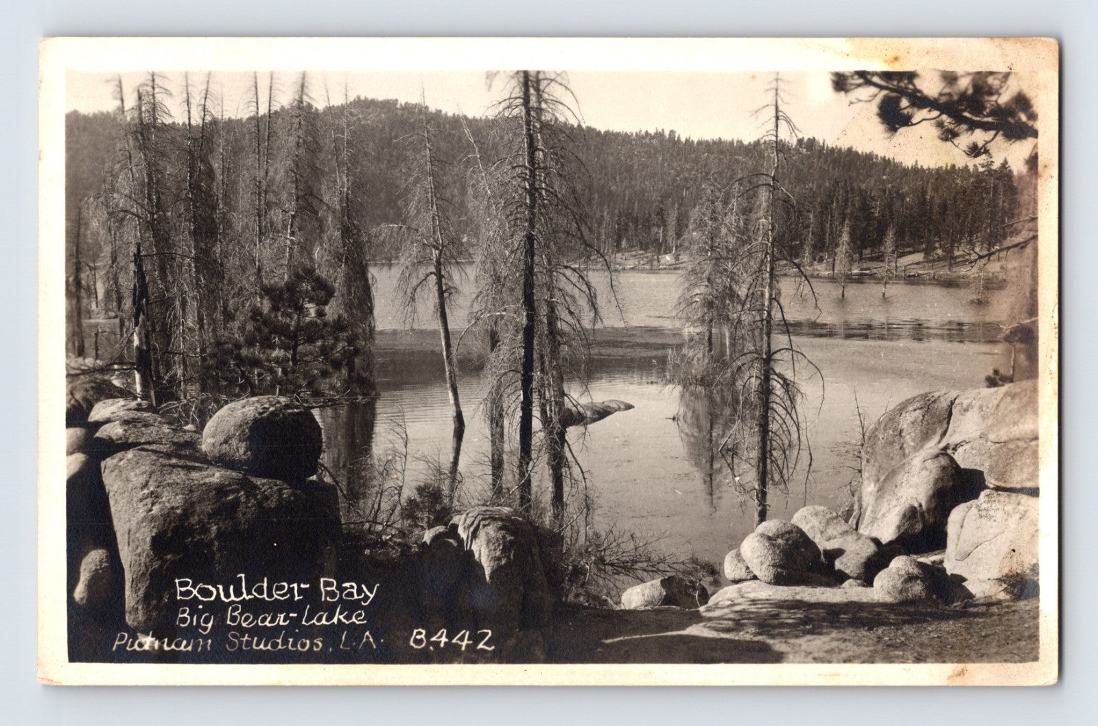 Big Bear Lake California Boulder Bay RPPC postcard with granite shoreline and forest lake scenery