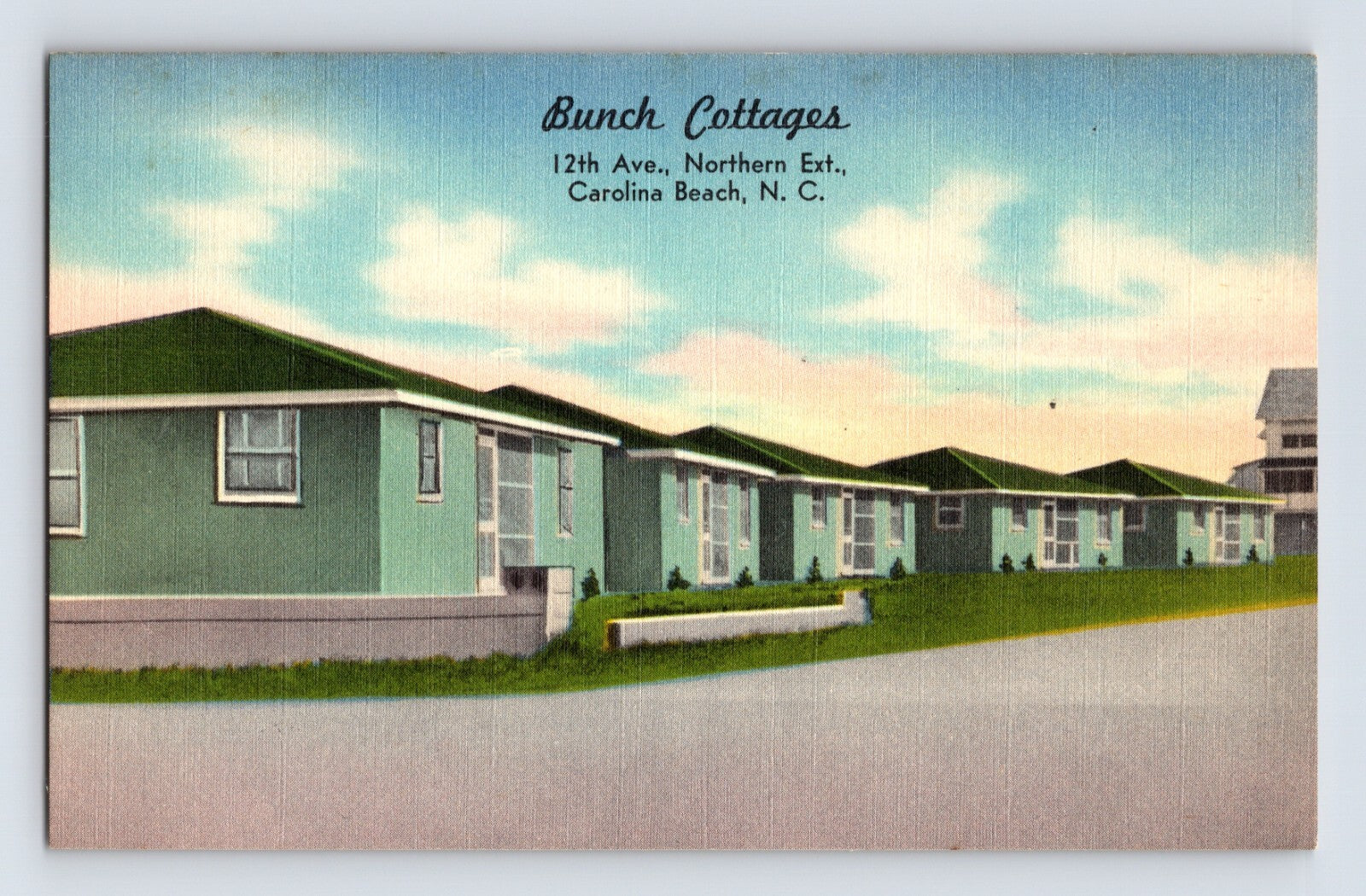 Carolina Beach North Carolina Bunch Cottages row of pastel rental cabins along 12th Avenue Northern Extension, 1940s linen postcard scene