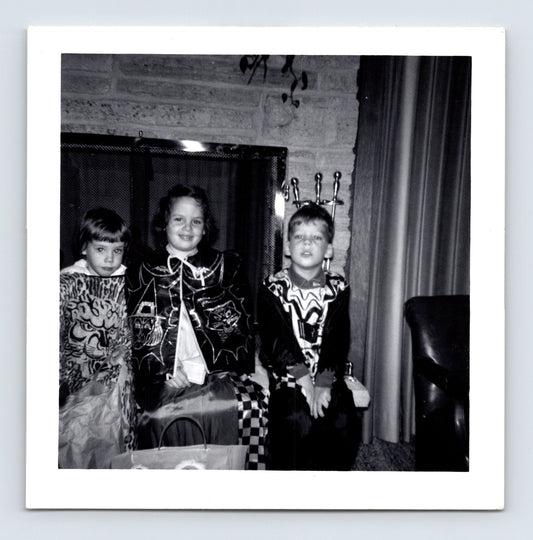 Halloween 1962 children costumes trick or treat masks fireplace candy bag snapshot