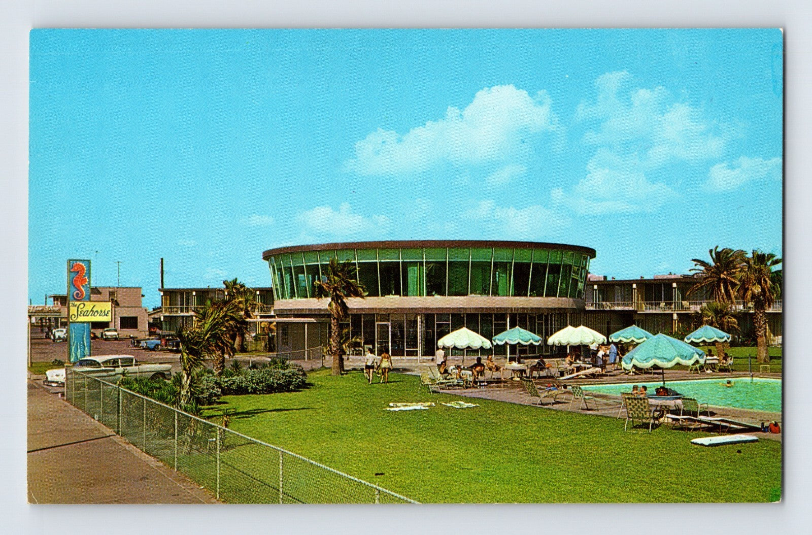 Galveston Texas Seahorse Motel pool mid century modern circular glass building palm trees 1960s chrome postcard