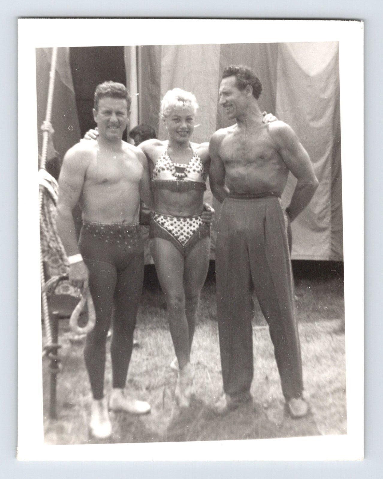 Mills Bros Circus showgirl with two acrobats posing backstage beside big top tent 1964 photograph