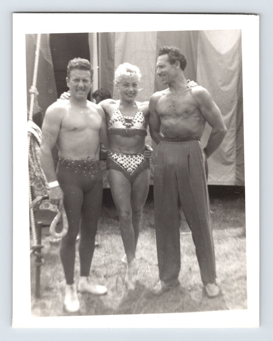 Mills Bros Circus showgirl with two acrobats posing backstage beside big top tent 1964 photograph