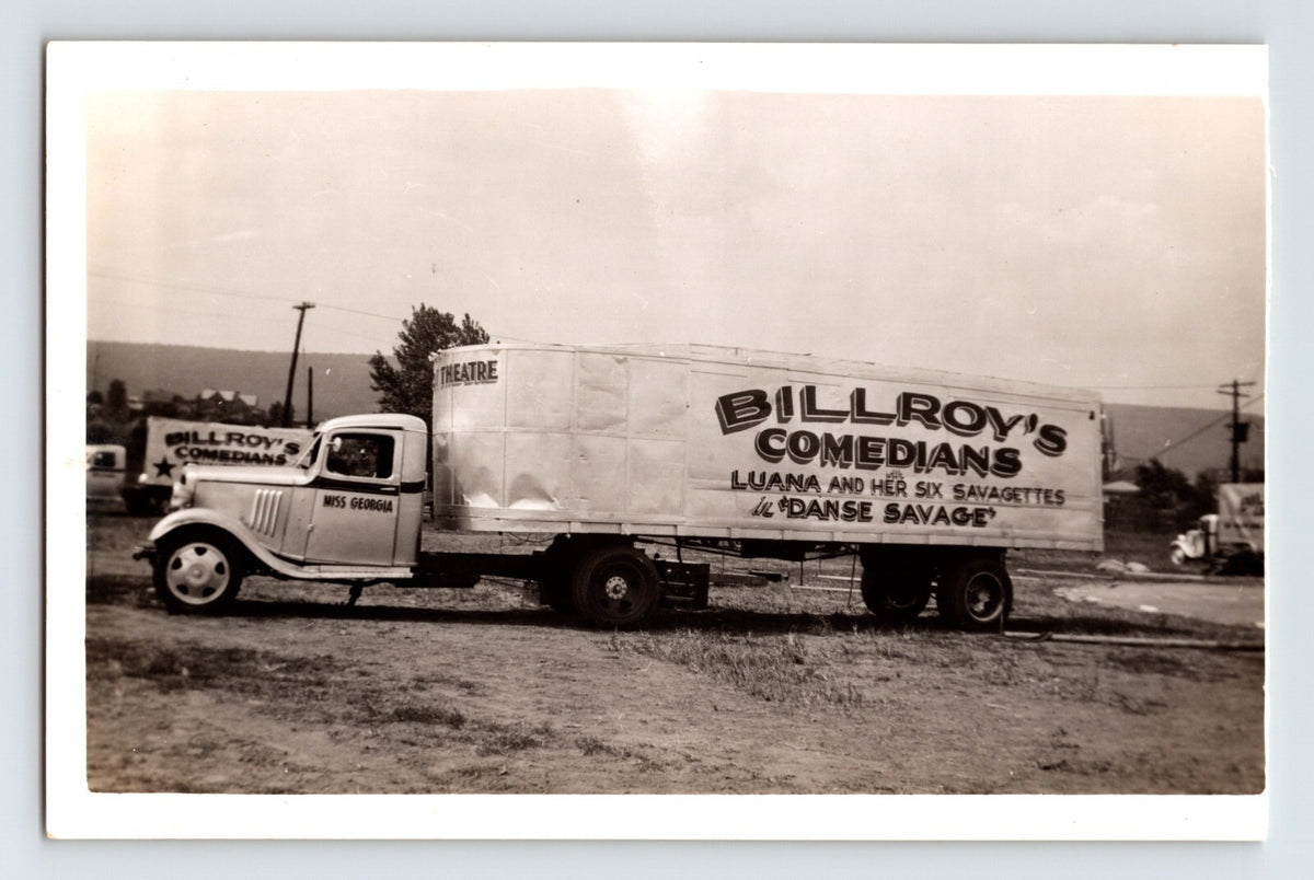 Vintage truck with 'Billroy's Comedians' advertisement on a plain background