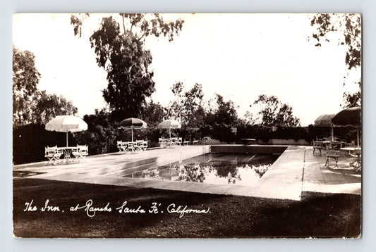 Rancho Santa Fe California swimming pool at The Inn real photo postcard with patio umbrellas and resort landscaping.