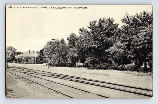Merced California Southern Pacific Railroad depot and park with tracks in foreground 1910s postcard