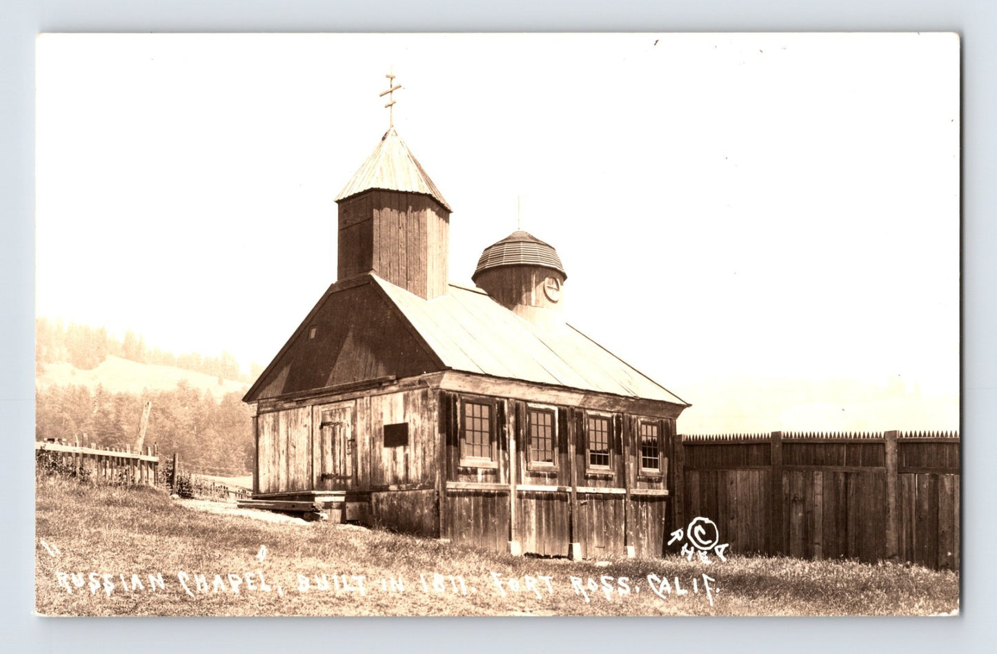 Fort Ross California Russian Chapel wooden church building RPPC postcard with handwritten caption and fenced compound exterior view