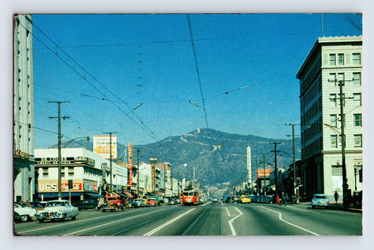 Glendale California Brand Avenue 1955 downtown street scene with Coca Cola sign, automobiles, and San Gabriel Mountains backdrop