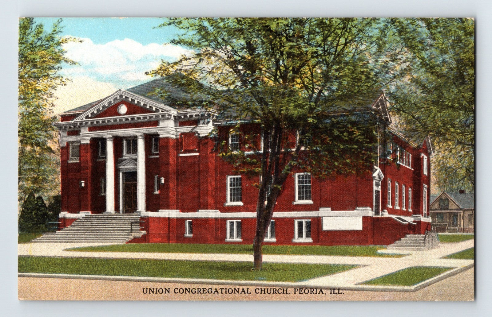 1910s postcard of Union Congregational Church in Peoria Illinois showing red brick neoclassical building with white columns and landscaped grounds
