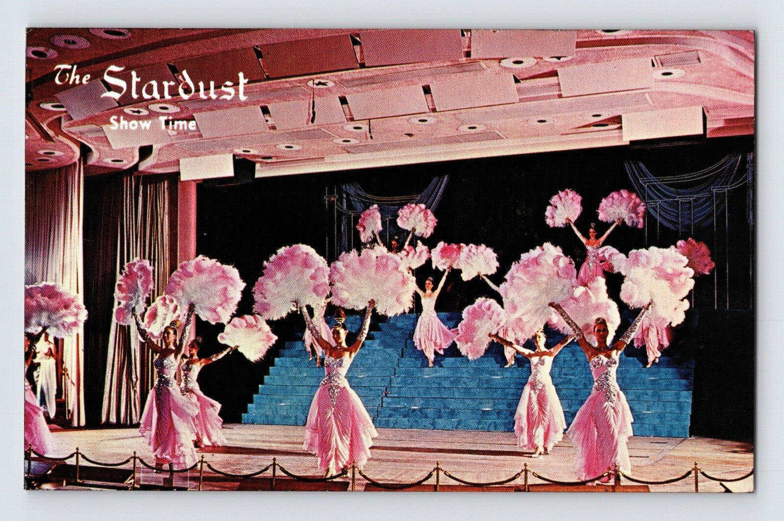 Las Vegas Nevada Stardust Hotel showgirls 1960s postcard with pink costumes stage performance and feather fans