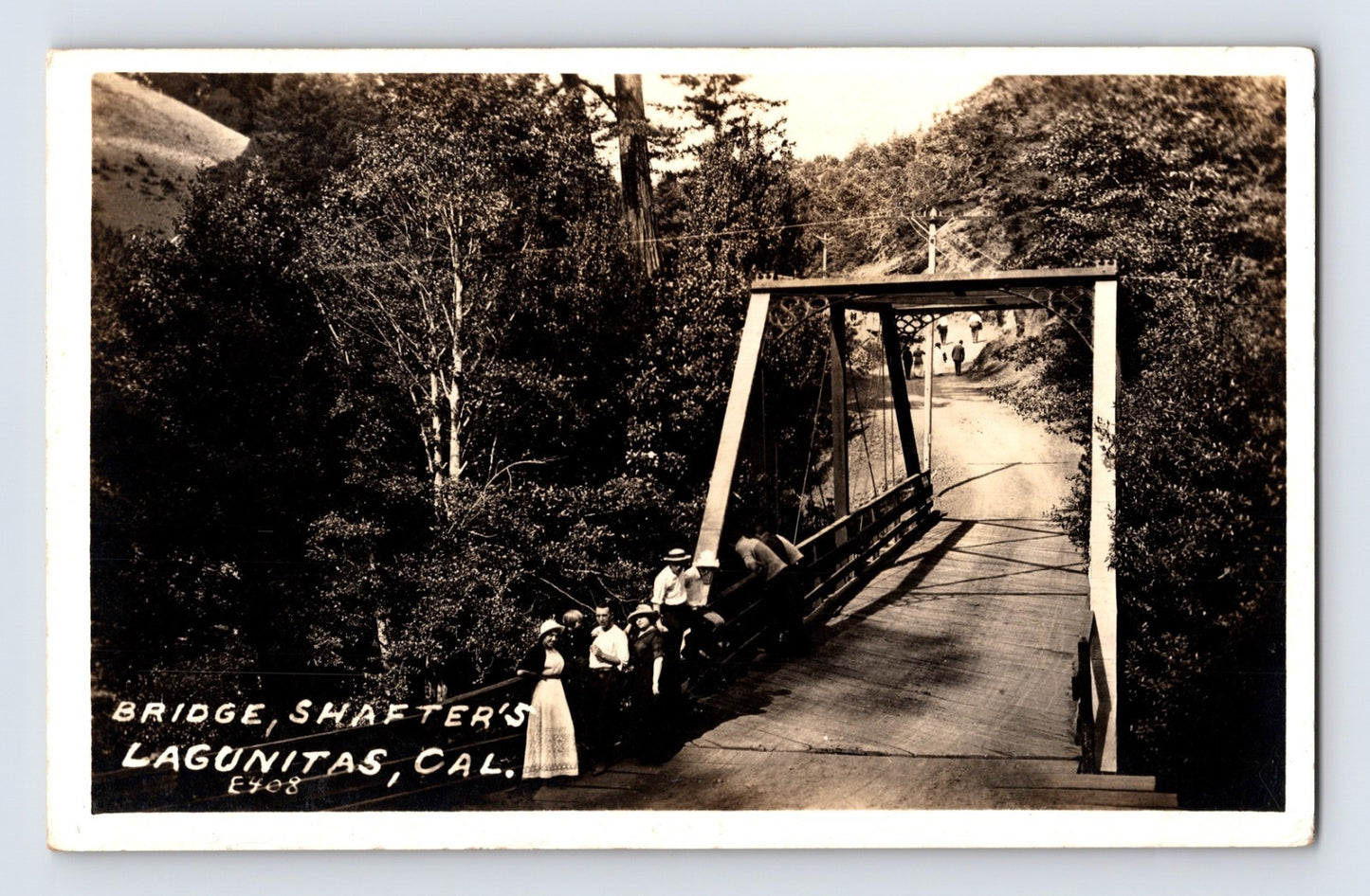 Lagunitas California Shafter's Bridge 1910s RPPC postcard showing pedestrians gathered on a narrow steel truss bridge crossing a wooded rural creek in Marin County.
