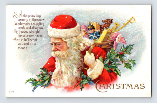 Santa Claus carrying dolls, toys, and a toy soldier through holly branches beside a humorous Christmas verse on this 1910s postcard.