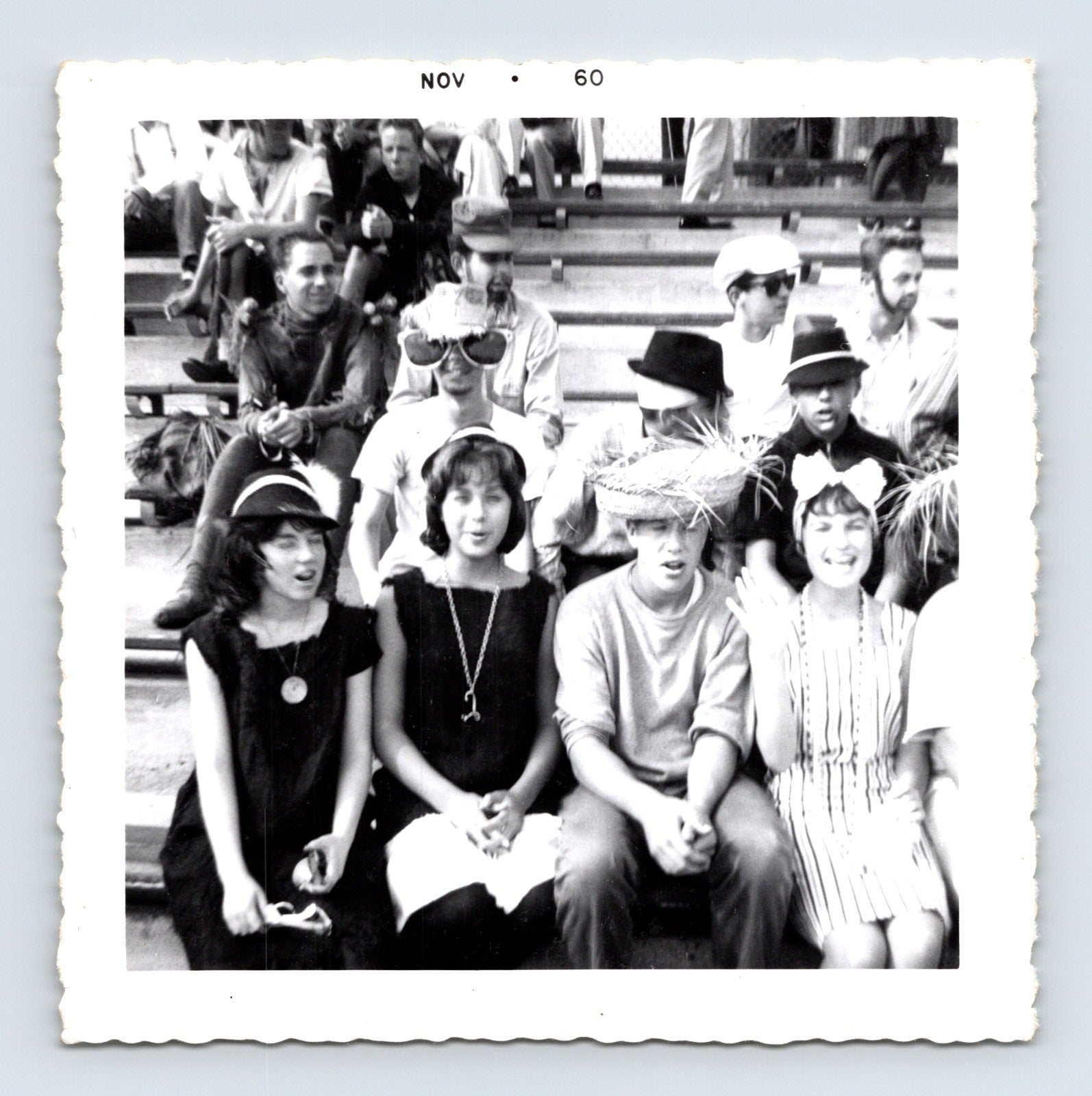 Halloween 1960 teenagers costumes bleachers hats novelty glasses group snapshot vintage photo