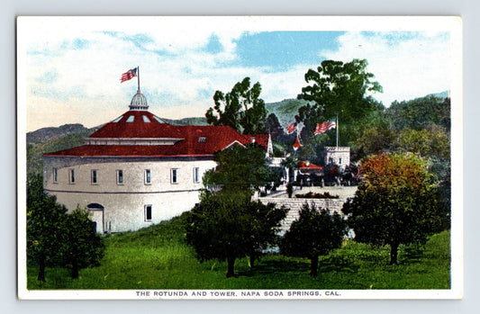 1910s postcard of Rotunda and Tower at Napa Soda Springs in Napa, California with red-roofed round building, American flags, and landscaped grounds